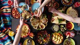 Fototapeta Tęcza - An authentic Mexican family celebrates Cinco de mayo together at a festive table. Mexican food