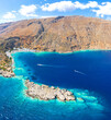 © robertharding - Aerial view of the village of Loutro nestled in the idyllic cove washed by turquoise sea, Crete island, Greek Islands