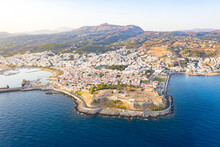 Aerial View Of Old Venetian Harbor And Fortezza, Citadel Of The Seaside Town Of Rethymno, Crete Island, Greek Islands