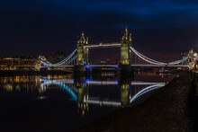 Tower Bridge At Night Just Before Sunrise, Reflecting In A Still River Thames, London