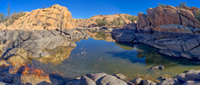 Reflective Lagoon Along East Bay Trail Of Willow Lake, Gray Line On Rock Is Where The Water Level Used To Be, Prescott, Arizona, United States Of America