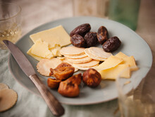 Appetizer Of Cheese, Crackers, Figs And Dates