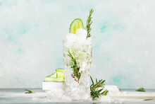 Gin Tonic With Cucumber, Alcoholic Cocktail Drink With Dry Gin, Rosemary, Tonic, Fresh Cucumber And Ice Cubes. Gray Background, Bar Tools, Copy Space