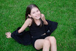 © OliaVesna - portrait of adorable teen brunette girl in black clothes outside. charming ukrainian child enjoying summer holidays vacation on green grass. pretty kids concept