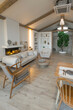 © 4595886 - cozy warm home interior of a chic country house with an open plan, wood finishes, warm colors and a family hearth