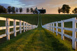 Summer sunset over barn and fence row along  Kentucky's backroads