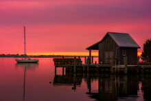 Red Morning Sky Over Roanoke Sound From Along The Boardwalk At The Manteo Waterfront Park In North Carolina