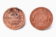 Obverse And Reverse Of The 3 Kopeck Coin With The Coat Of Arms Of Tsarist Russia Issued In 1913 On A White Background, Close-up. Copper Coin Of Tsarist Russia. Coin Collecting