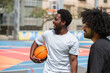 © Ivan - lifestyle young friends playing basketball together