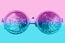 Violet Sunglasses With Sparkles On A Two-tone Background.
