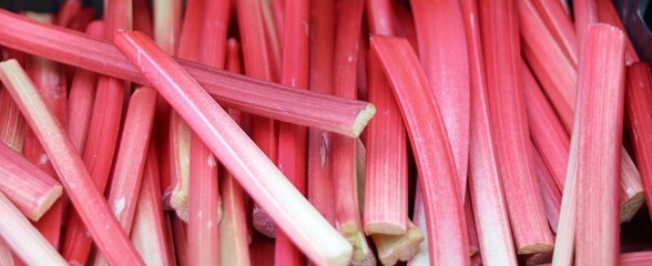 Wall Mural - Full frame background of cut pieces of pink red rhubarb