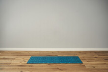 A Sporty Blue Rug Unrolled On The Floor. Workout, Yoga, Pilates