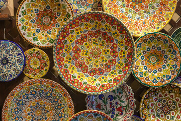 Colorful ceramic plates at Madinat Jumeirah souk, souvenir shop in Dubai