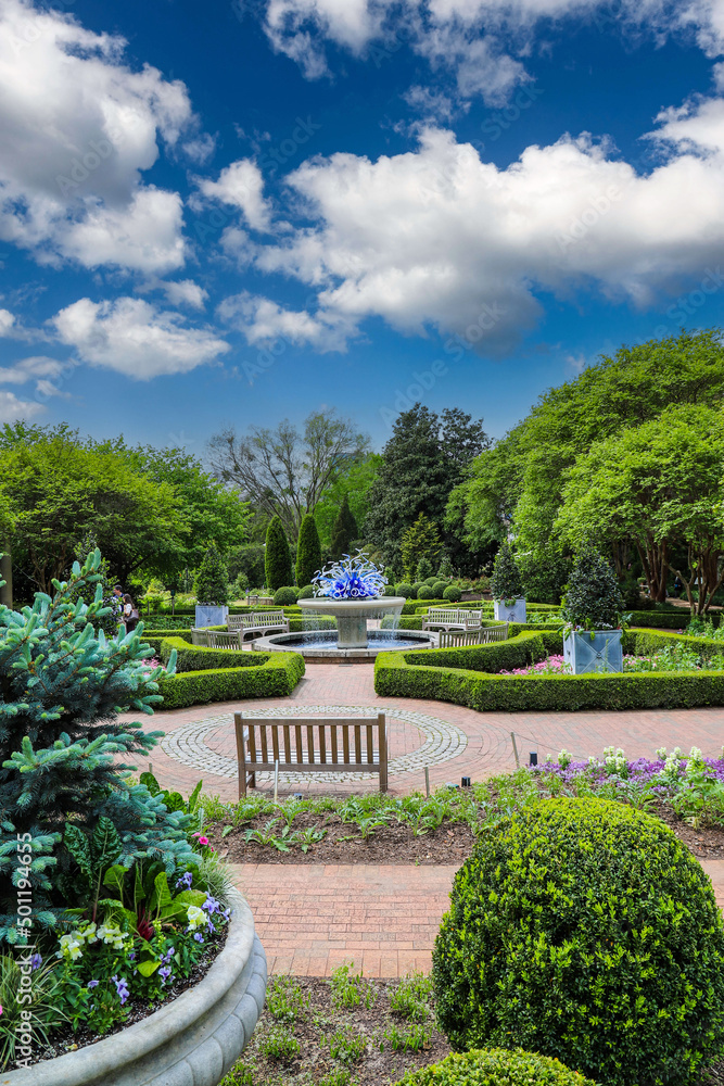 a gorgeous summer landscape in the garden with lush green trees and ...