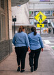 © Alberto GV PHOTOGRAP - couple walking on the street worker store shopping people woman miami downtown usa florida