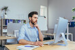 © Liubomir - The focused designer works in a modern studio office, the man works during the day at the computer