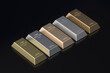 Set of different metal ingots. Gold, silver, aluminum, bronze, copper bullions. Reserves of precious metals. 3d render