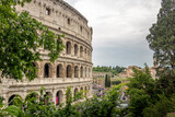 Fototapeta  - Roman Colosseum at Day under cloudy skies in Rome, Italy 01