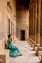 Woman Between Pillars Of Philae Temple, Aswan, Egypt