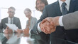 © ASDF - handshake of business partners in conference room