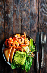 Sticker - Healthy appetizer or snack avocado shrimp bruschetta. Fried shrimp and mashed avocado on plate for breakfast