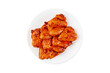 Marinated chicken wings in red sauce on isolated white background.Copy space.Semifinished. Fast cooking.Raw marinated chicken meat.Top view.