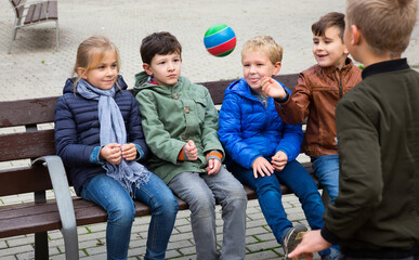  Children playing with small ball outdoor. High quality photo