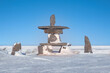 An Arctic cultural landmark known as an Inukshuk, used as navigational aids and communication by First Nations people in the Canadian north. Churchill, Manitoba.