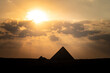 great pyramid of Mikerina in Cairo, Egypt. Pyramids of Menkaura against cloudy sky in the evening at a beautiful sunset