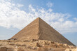 The great pyramid of Cheops in Cairo, Egypt. Pyramids of Khafra against blue sky.