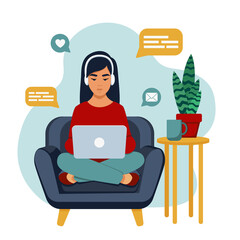 A girl on a chair with a laptop on her lap