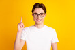 Photo of young handsome man point finger idea plan clever solution decision isolated over yellow color background