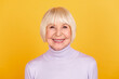 Photo of mature cheerful pretty woman toothy smile visit clinic cavity protection isolated over yellow color background