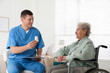 © New Africa - Caregiver giving medication to senior woman indoors. Home health care service