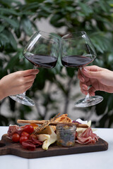 Couple with glass of red wine in outdoor restaurant,