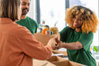 © Syda Productions - charity, donation and volunteering concept - close up of volunteers giving box of food at distribution or refugee assistance center