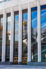 Wall Mural - Moscow, Russia April 19, 2022. Architectural details of buildings in the territory of the Moscow Kremlin. Kremlin Palace of Congresses and reflection in its windows