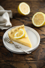 Poster - Traditional homemade lemon tart on a white plate