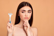 attractive girl holding in hand razor shaver blade i
