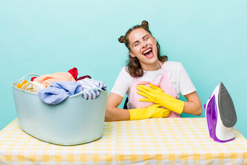 young pretty woman  laughing out loud at some hilarious joke. house work concept