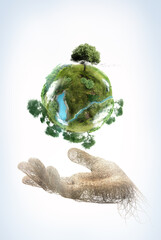 Poster - hand made of branches holding a green planet