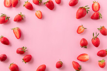 Juicy Ripe Strawberries On Pink Background, Top View. Strawberry Frame, Copy Text, Top View