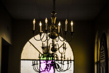 Old Style Chandelier Brown Wall