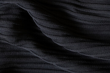 Wall Mural - Black wavy fabric as background close up, textile and fashion