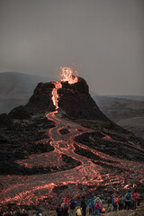 Poster - Evening view of the volcano eruption in Iceland. People are watching the fiery river