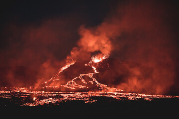 Poster - Night view of a volcano eruption in Iceland.  fiery rivers flowing down the slopes of the mountain