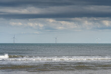 Offshore Wind Turbines Seen From The Beach At Cambois, Blyth, Northumberland, UK.