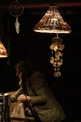 Wall Mural - decorative lamp and girl selling food at narracje festival in gdansk, poland