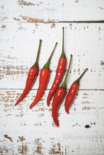 Red Hot Chili Peppers On Wooden Background