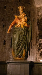 Wall Mural - Vertical shot of the statue of Polish queen and baby in the Wieliczka Salt mine, Poland